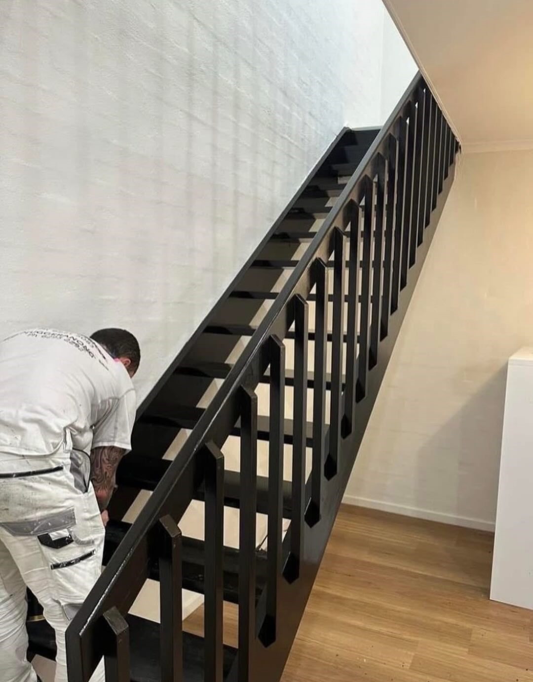 Freshly painted staircase handrail and balustrade